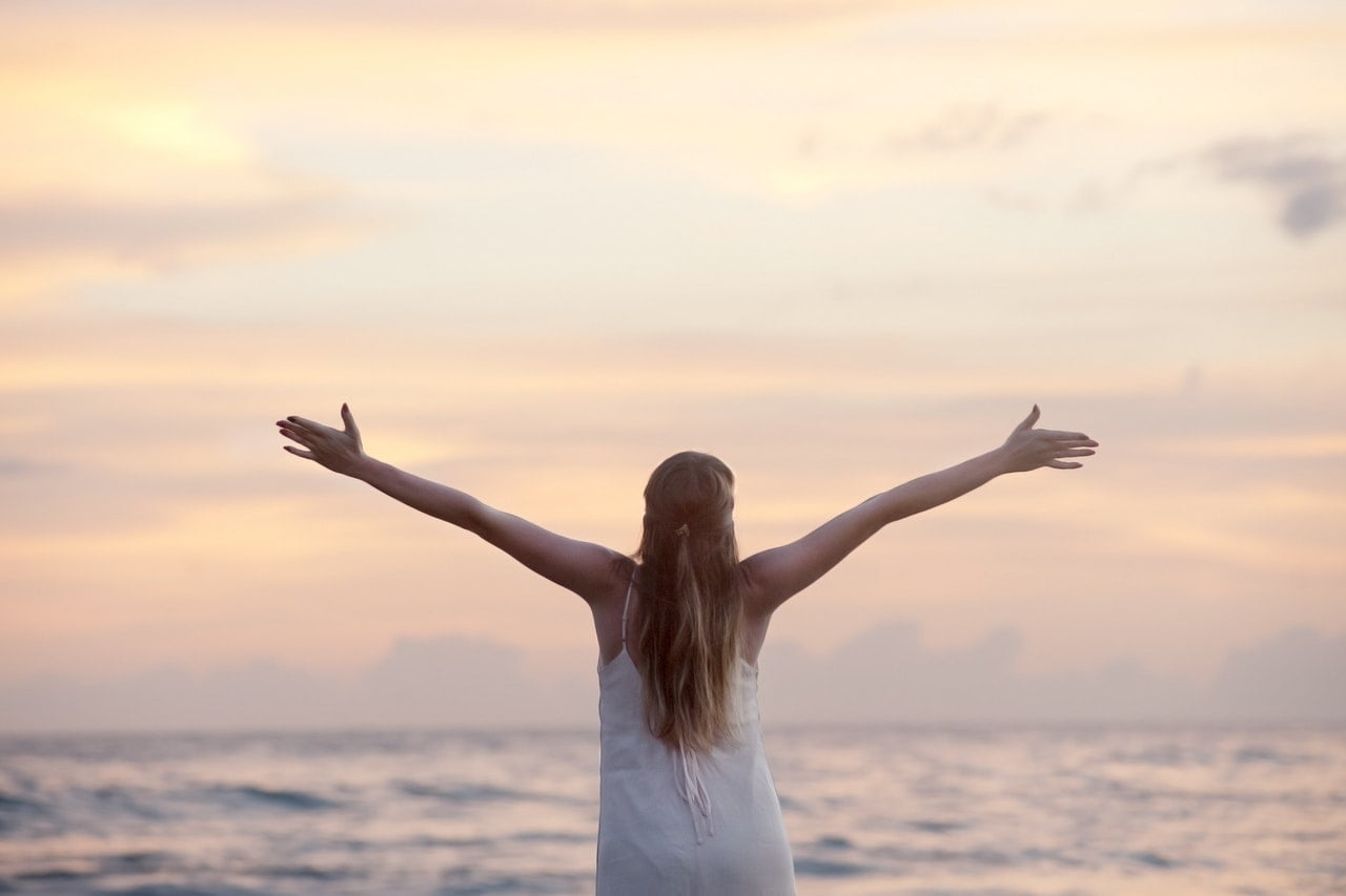 girl with arms outstretched
