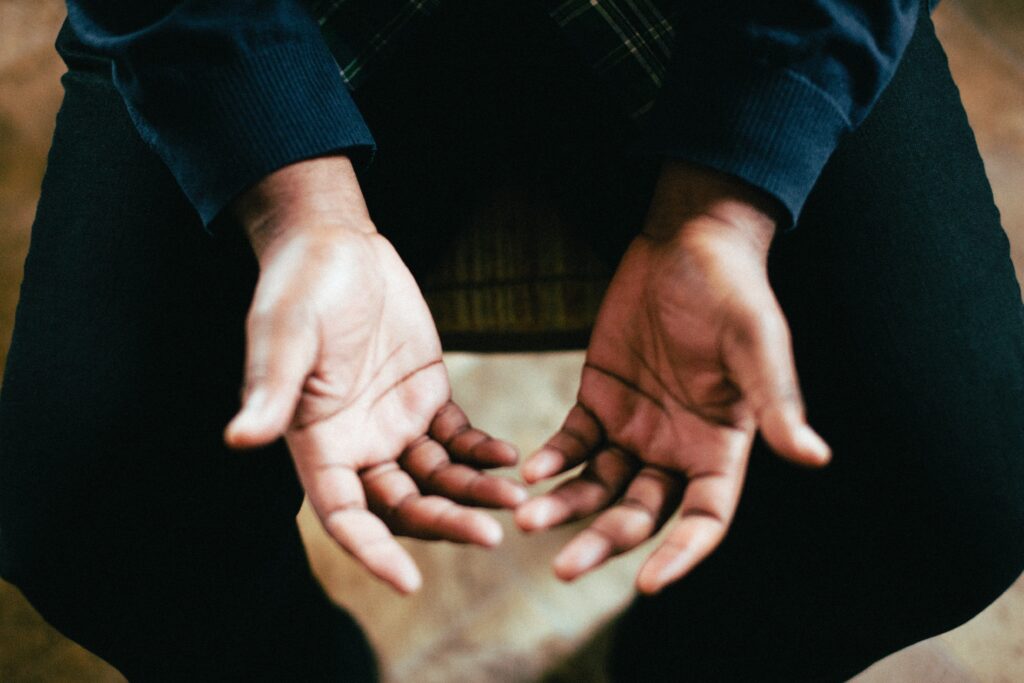 man looking at his hands