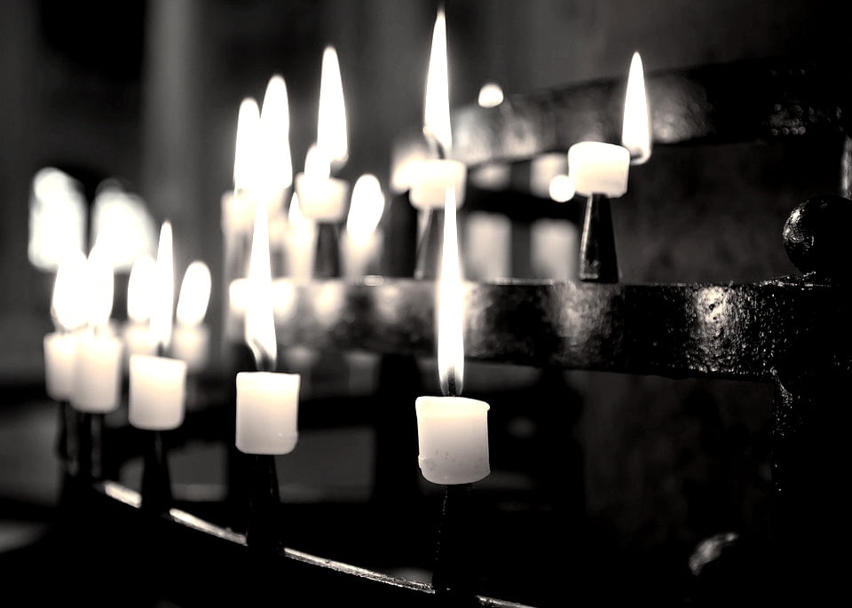 candles burning in a church