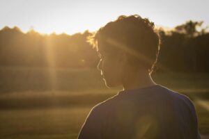 sad boy in the sunshine