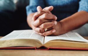 man reading the holy scriptures