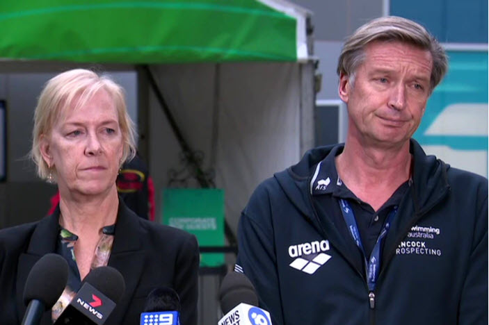 Swimming Australia officials speaking to the media