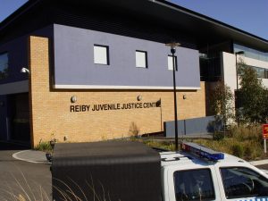 reiby juvenile justice centre with police car out the front