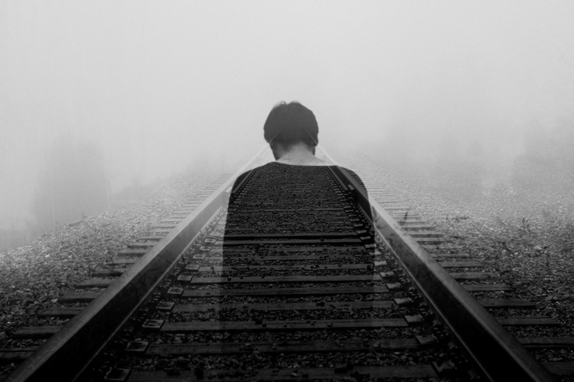 lonely boy on train tracks