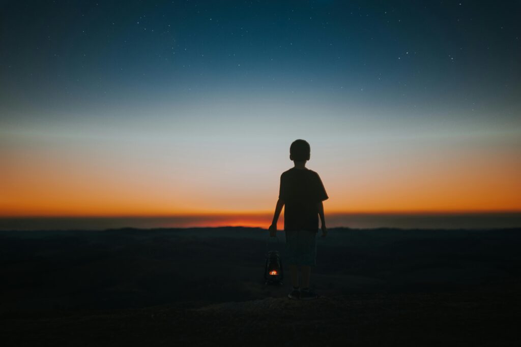 child holding lantern