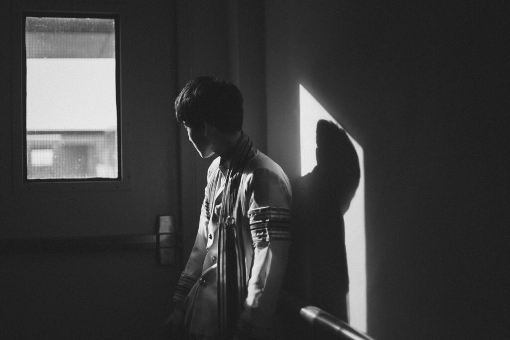 boy looking out a window