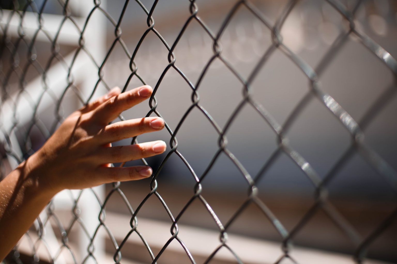 touching prison fence