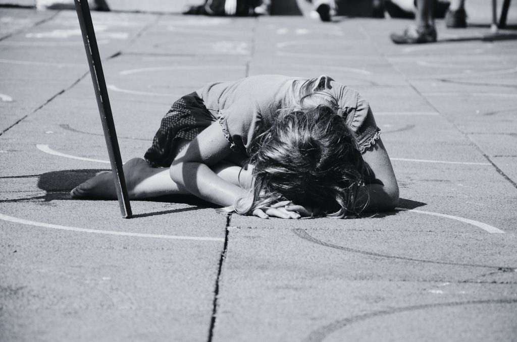 girl laying on concrete