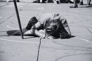girl laying on concrete