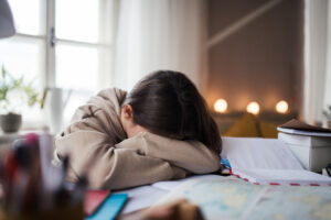 young girl crying over school work