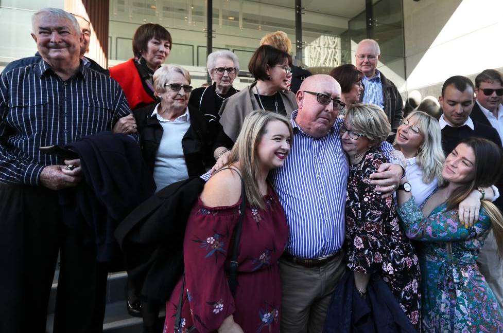 survivor peter creigh hugging family outside court