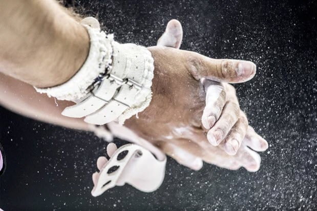gymnast chalking up her hands