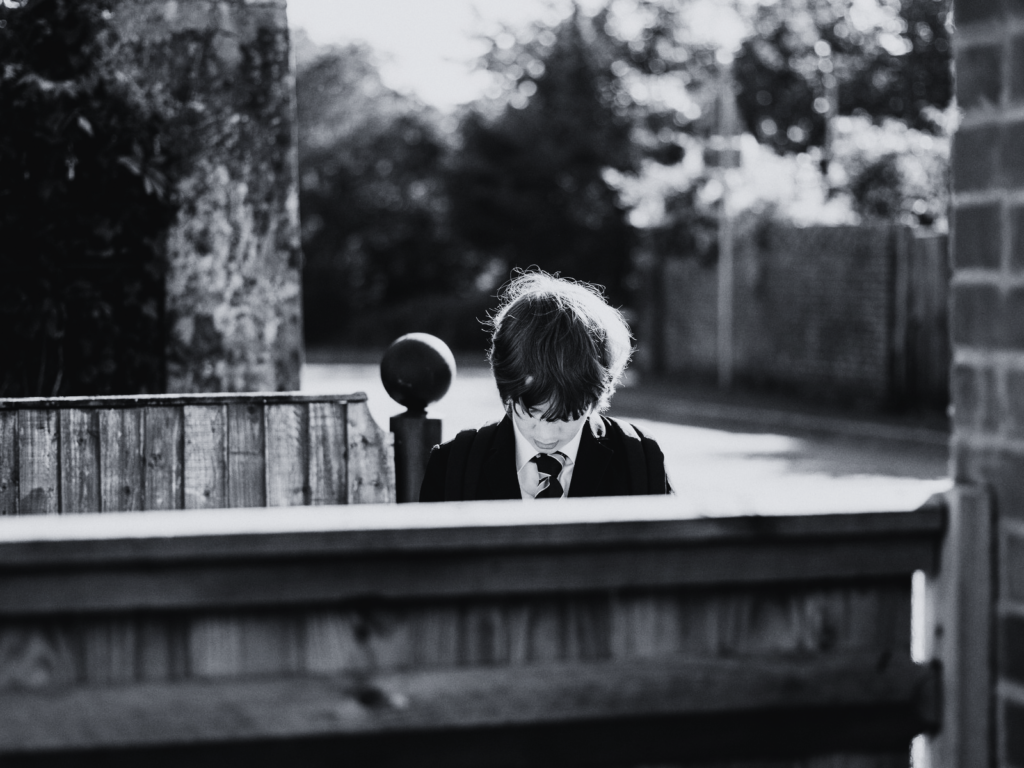 student waiting outside