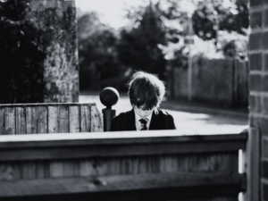 student waiting outside