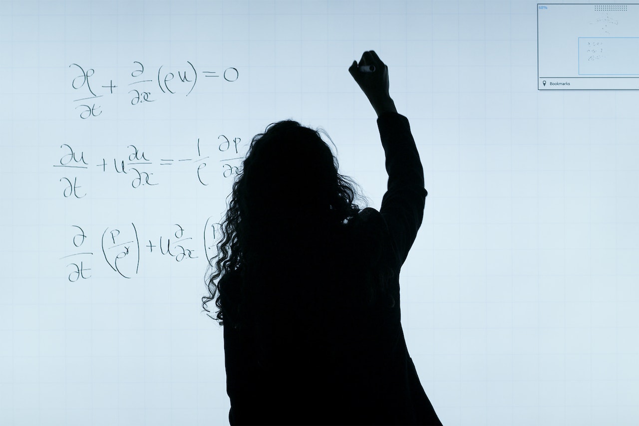 teacher writing on board